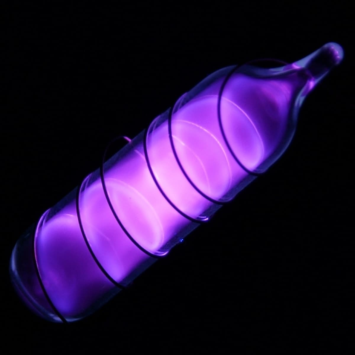 Vial of glowing ultrapure argon. Original size in cm: 1 x 5
