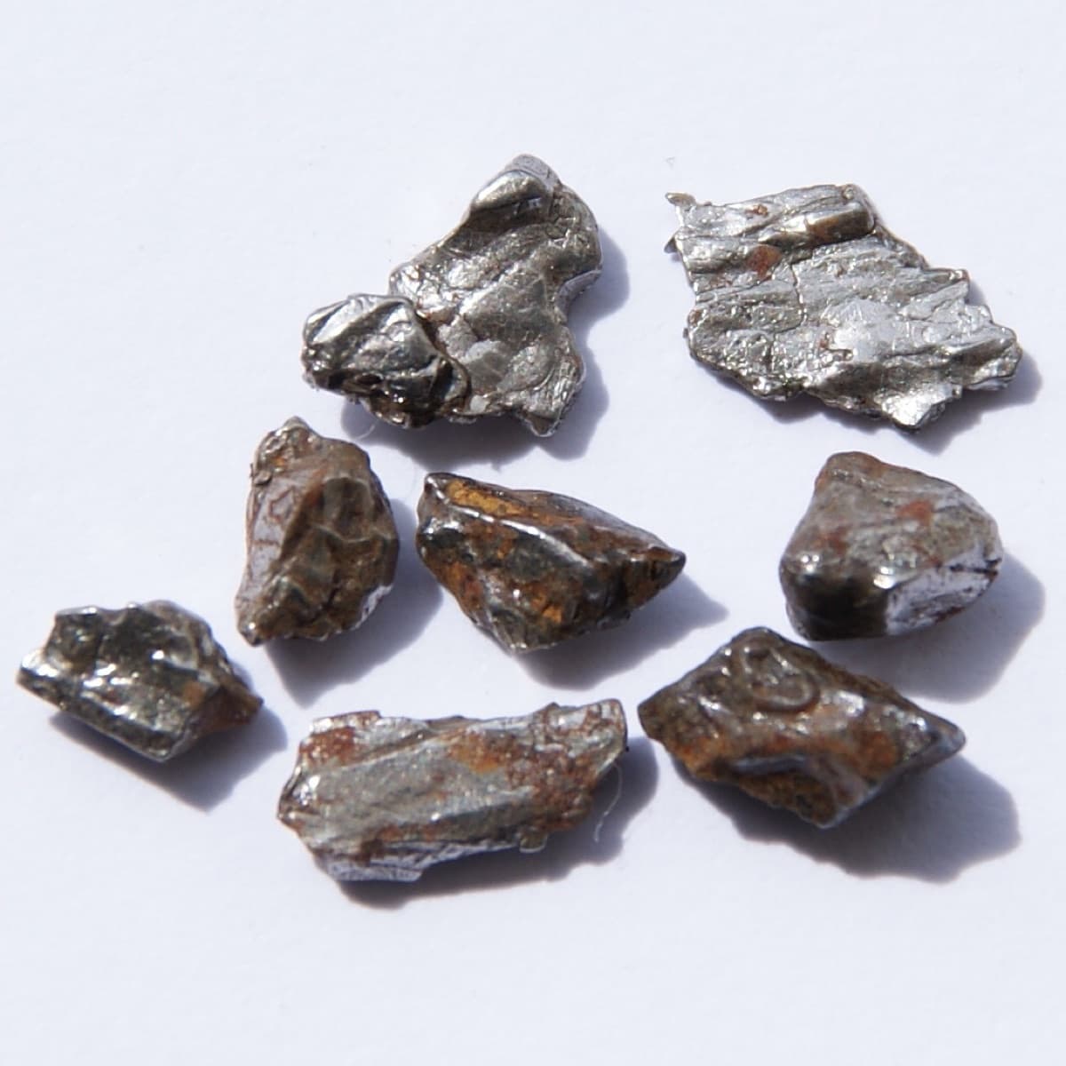 Fragments of an iron meteorite, about 92% iron. Original size of the single pieces in cm: 0.4 - 0.8