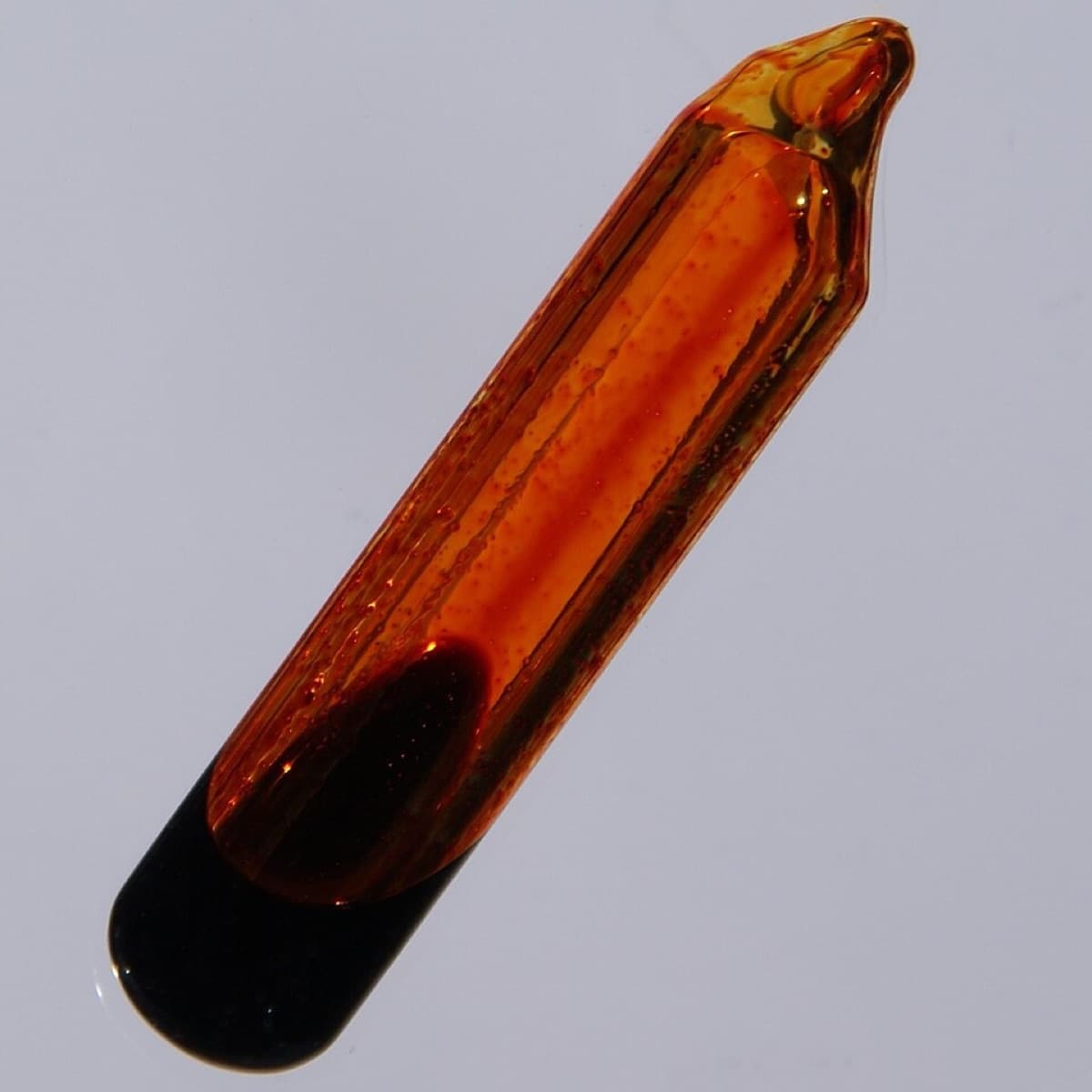 99.5 % pure liquid Bromine in a 4 x 1 cm big glass ampoule, cast in acrylic