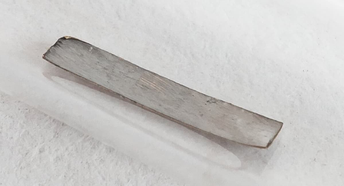 Technetium Sample inside a sealed glass ampoule, filled with argon gas. 6x1 mm goldfoil covered with 99Tc powder (electroplated).