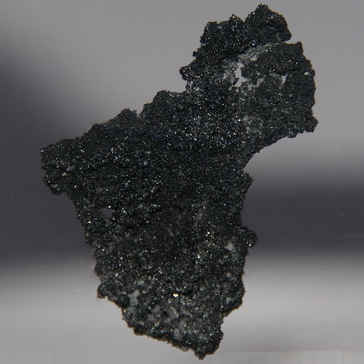 Pure Crystalline Boron, front and back side. Original size in cm: 2 x 3