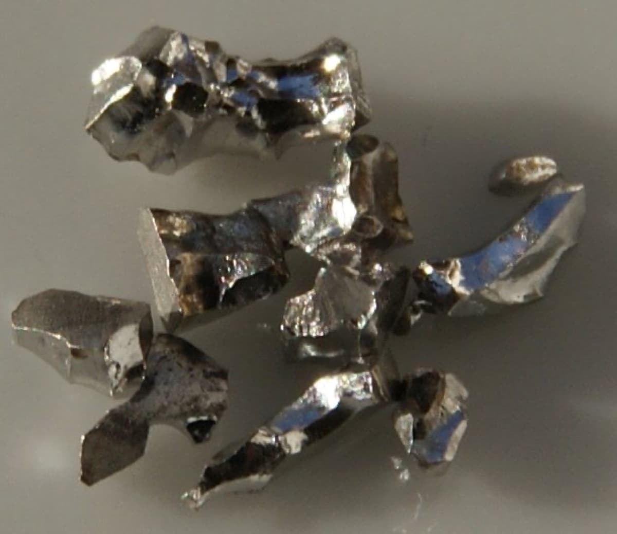 Pieces of Pure Iridium, 1 gram. Original size: 0.1 - 0.3 cm each