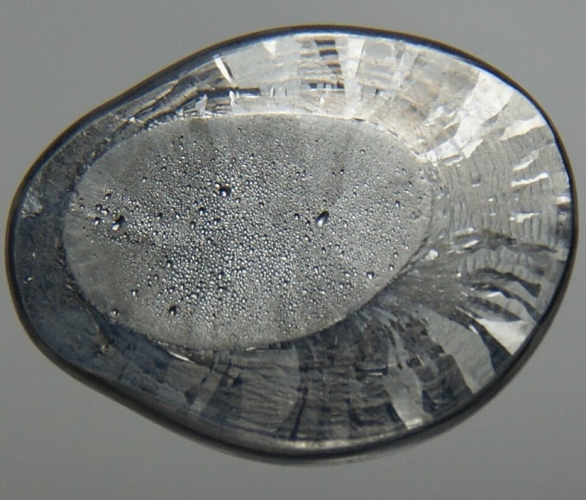 Ultrapure Lead Bead from two sides. Original size in cm: 1.5 x 2